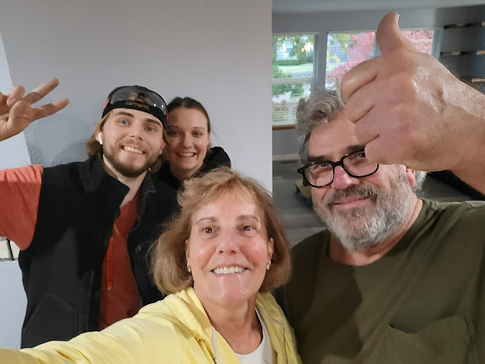 group photograph of the owner with his happy customer